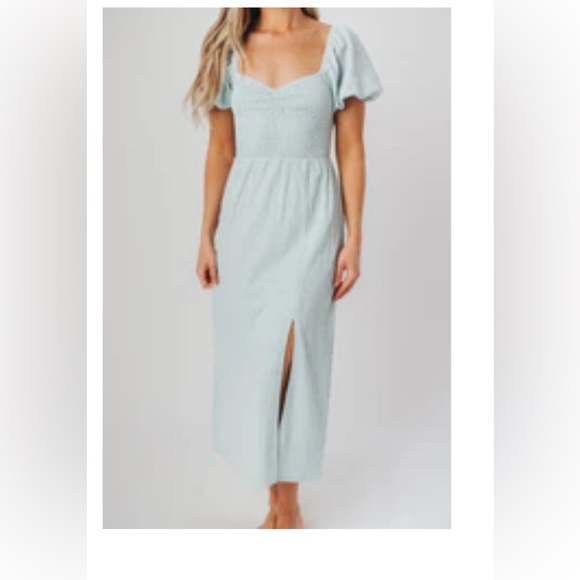 Worth Collective Dresses & Skirts - Boutique baby blue dress with puffed sleeves and cross-criss back. Adorable!